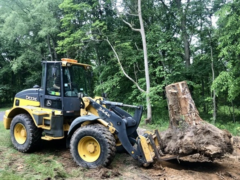 John Deere 344K with Big Stump